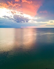 Fototapeta premium Colorful sunset over calm water