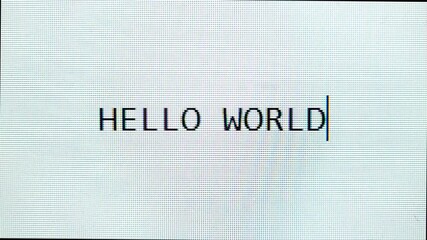 Word "HELLO WORLD" is typing and erased on pixel-style screen. - Powered by Adobe