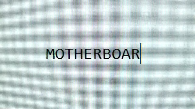 Word "MOTHERBOARD" is typing and erased on pixel-style screen.