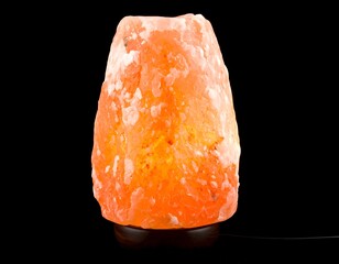 Orange salt lamp on black