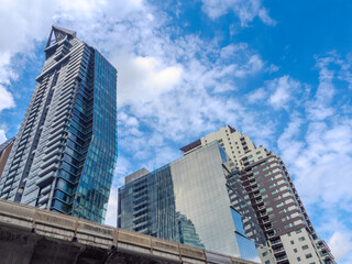 Fototapeta premium high rise towers building residential apartments and commercial buildings on Sukhumvit Rd Thong Lot and Ekkamai BKK Bangkok Thailand
