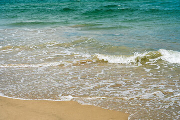Blue Sea Waves Crashing On Sandy Beach