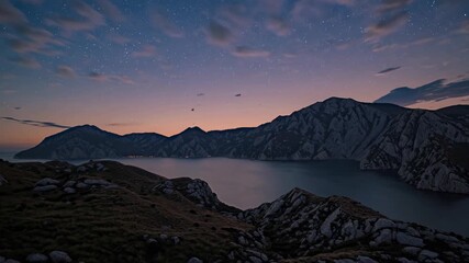 Panoramic View of Mountainous Landscape at Sunset in Antalya, Capturing Calm Waters and Starry Sky for a Serene Experience