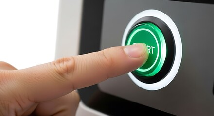 Human Finger Pressing a Bright Green 'start' Button on a Modern Device