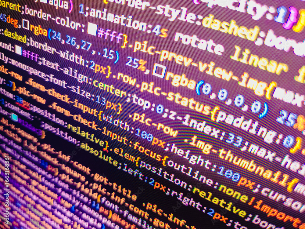 Wall mural computer code background. colorful programming source typed on the screen of the monitor with shallo