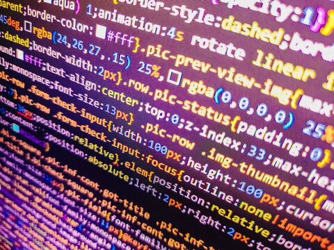 Computer code background. Colorful programming source typed on the screen of the monitor with shallow focus effect. Modern technology and futuristic concept abstract visualization of software. 
