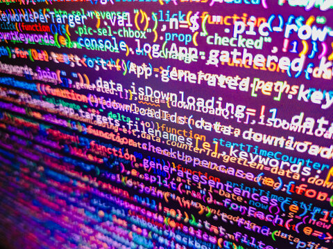 Computer code background. Colorful programming source typed on the screen of the monitor with shallow focus effect. Modern technology and futuristic concept abstract visualization of software. 
