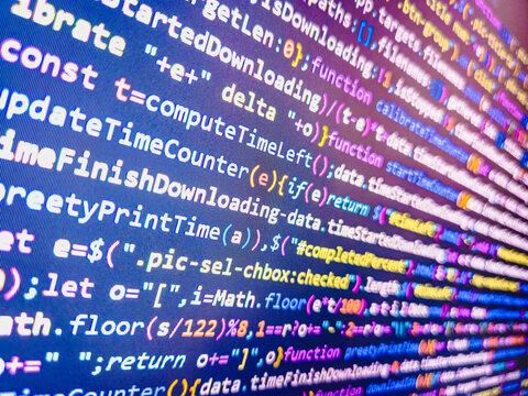 Computer code background. Colorful programming source typed on the screen of the monitor with shallow focus effect. Modern technology and futuristic concept abstract visualization of software. 
 - Powered by Adobe