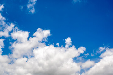 Bright Blue Sky with Fluffy White Clouds on a Sunny Day