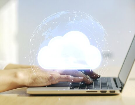 Hands typing on laptop, cloud graphic