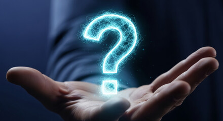 A hand gently holds a glowing blue question mark, symbolizing inquiry, uncertainty, or the search for answers.  Conceptual image ideal for help, FAQ, or problem-solving themes.