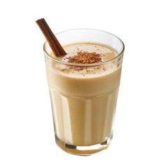 Glass of creamy beverage with cinnamon stick and grated topping