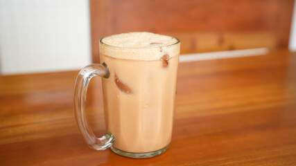 Iced Milk Tea or Es Teh Tarik in a cafe
