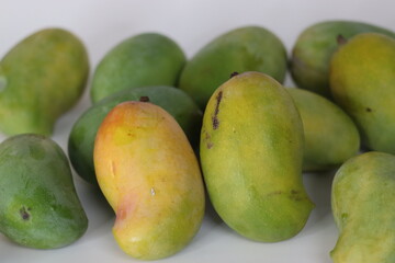 Raseeli mangoes with green to yellow orange skin, a South Asian fruit for freshness and nature