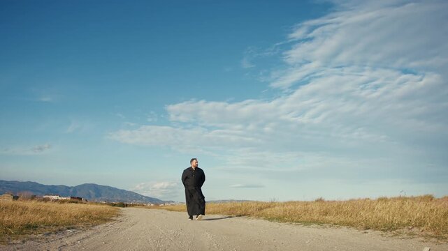 Priest Following The Step Of God In The Nature 