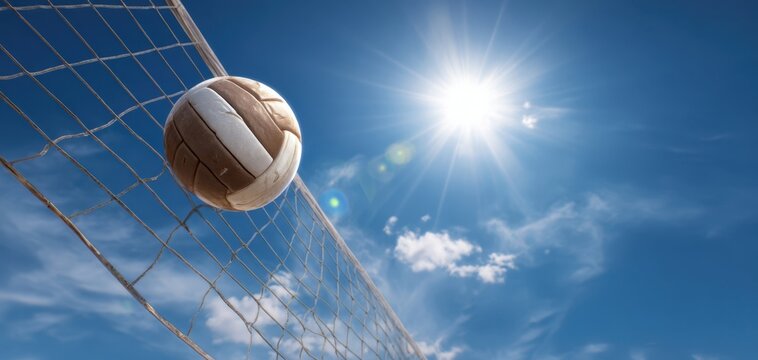The volleyball soaring toward the net under the bright summer sun.