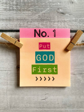Inspirational Quote - put God first on notepaper background.