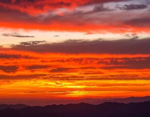 Fototapeta premium Fiery sunset over mountains
