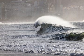 perfect wave at copacabana beach in rio de janeiro.