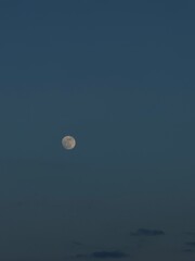 full moon over the blue sky