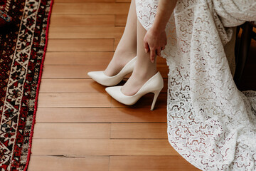 Bride Adjusting White High Heels on Wedding Day