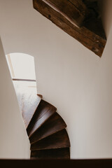 Rustic Wooden Spiral Staircase in Old Interior