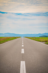 Endless straight road at Esanuka Line, Hokkaido countryside, Japan