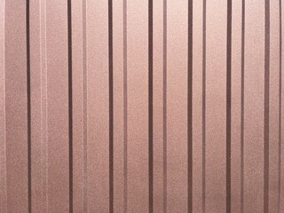 Detailed close-up of corrugated steel surface in natural daylight, showing metallic texture and shadows. Suitable for backgrounds, industrial designs, and textures.