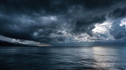 Obraz premium Ominous dark clouds loom over a tranquil ocean as twilight approaches