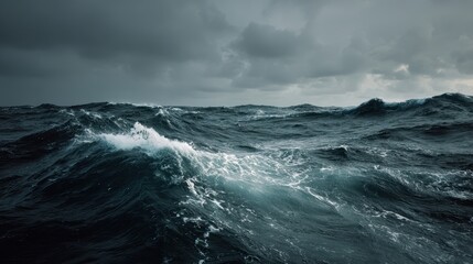 Choppy ocean waves beneath a stormy sky during late afternoon hours
