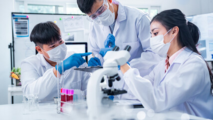 Diverse team of scientists, with a strong female presence, collaborating on blood testing in a modern laboratory, symbolizing teamwork, inclusion, empowerment, and healthcare innovation.