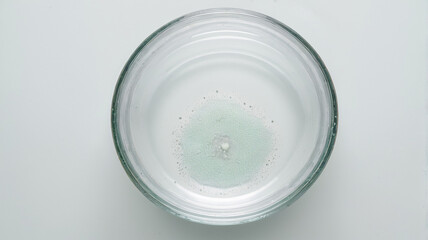 Overhead macro of a clear glass beaker with nutrient solution