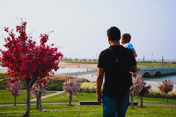 Man and child in park 