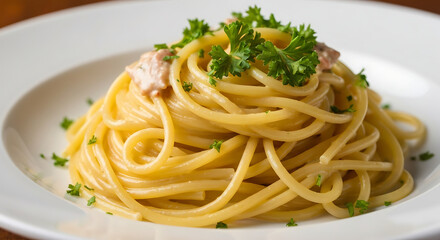 Spaghetti with sauce and parsley on a white plate