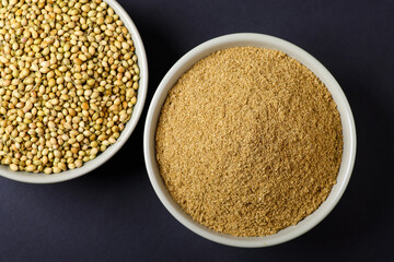 Indian food spices called coriander and coriander powder isolated on black background 