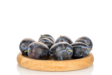 Juicy sweet black plums isolated on white background, close-up.