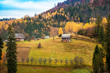 Breathtaking landscape with a house in the Carpathian Mountains in autumn.