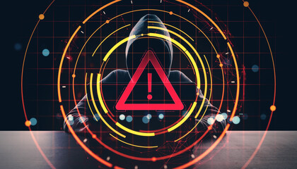 Cybersecurity threat warning icon over hacker in hoodie at desk with digital red alert interface and circular network detection graphics on dark background.