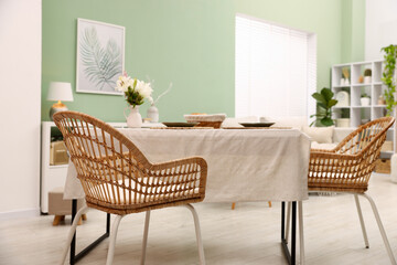 Stylish table with chairs and decor in dining room. Interior design
