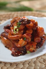 Cleanly plated soy-pickled oyster mushroom with soft texture and savory balance. A dish by Master Chef Hanshunseop. Photographed in Korea.
