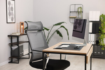 Stylish workplace with modern computer on wooden table in office