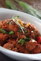 Braised flounder with lions mane mushrooms in spicy Korean chili sauce. A work by Master Chef Hanshunseop. Photographed in Korea.