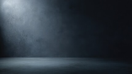 The empty dark space illuminated with dramatic lighting and textural elements.