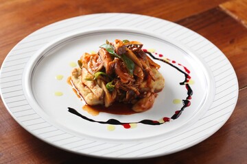 Grilled tofu topped with stir-fried mushrooms, a flavorful Korean dish crafted by master chef Hanshunseop.