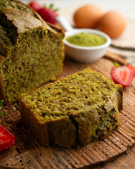 Japanese matcha tea cake decorated with strawberries. Traditional Japanese sweet cake recipe.