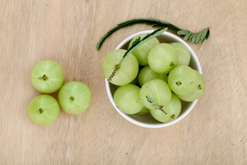 Fresh gooseberries (Amla) in white bowl