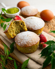 Japanese matcha tea cake decorated with strawberries. Traditional Japanese sweet cake recipe.
