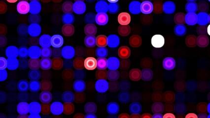 Abstract bokeh of vibrant blue and pink circles with red and white accents on a dark background