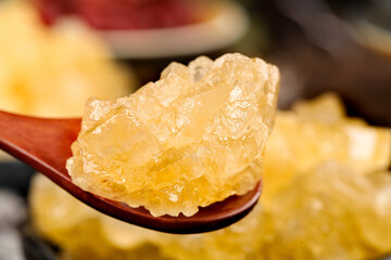 Golden Rock Sugar Crystals on Wooden Spoon - Traditional Handmade Candy Confection