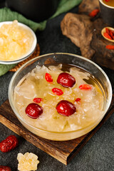 Chinese White Fungus Soup with Red Dates and Rock Sugar in Glass Bowl - Traditional Asian Sweet Dessert